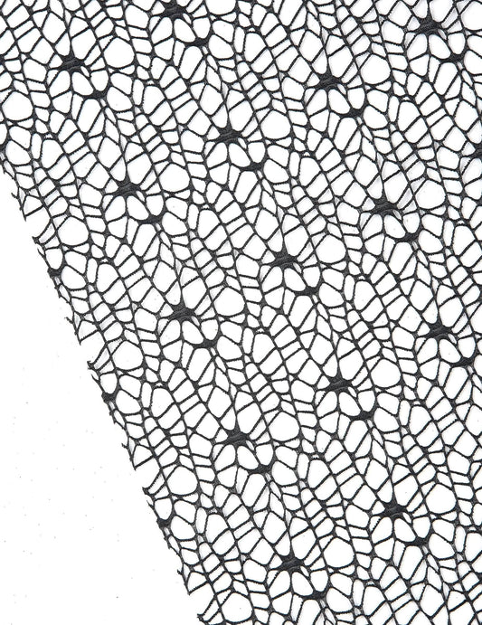 Gros plan sur la maille du chemin de table toile d'araignée Halloween