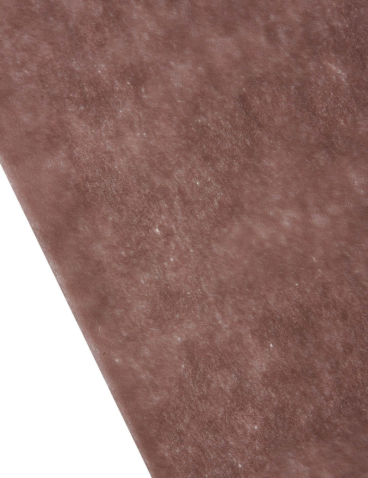 Közelkép a barna nem szőtt asztali futó textúrájáról, ünnepi dekoráció.