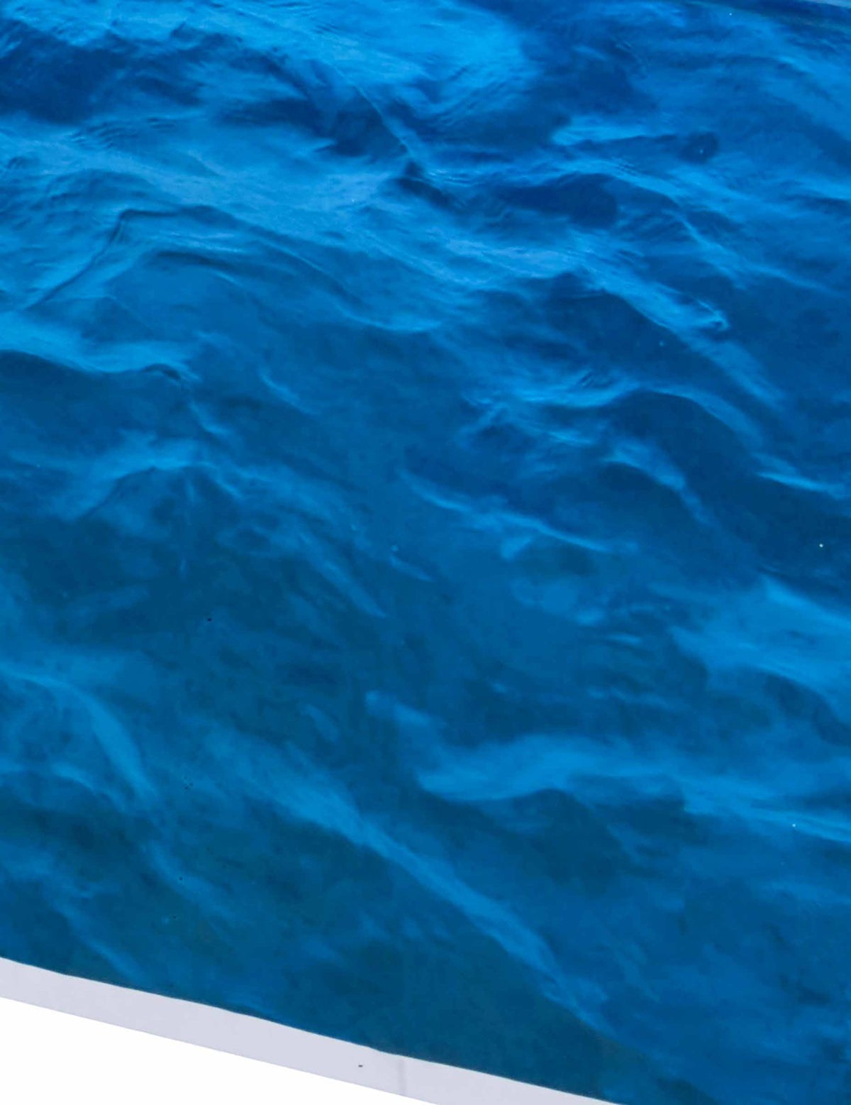 Détail des motifs de la nappe en plastique vagues de l'océan