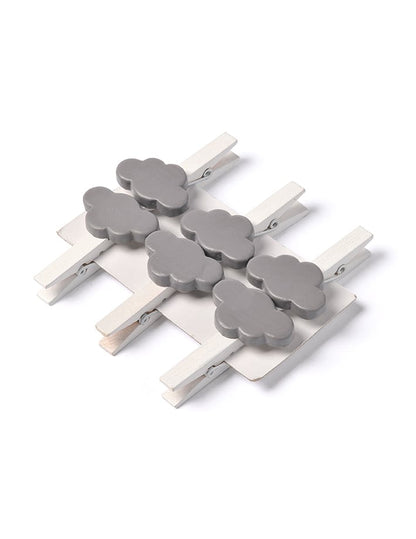 Vue de dessus du lot de pinces nuage pour décoration grises en bois blanc