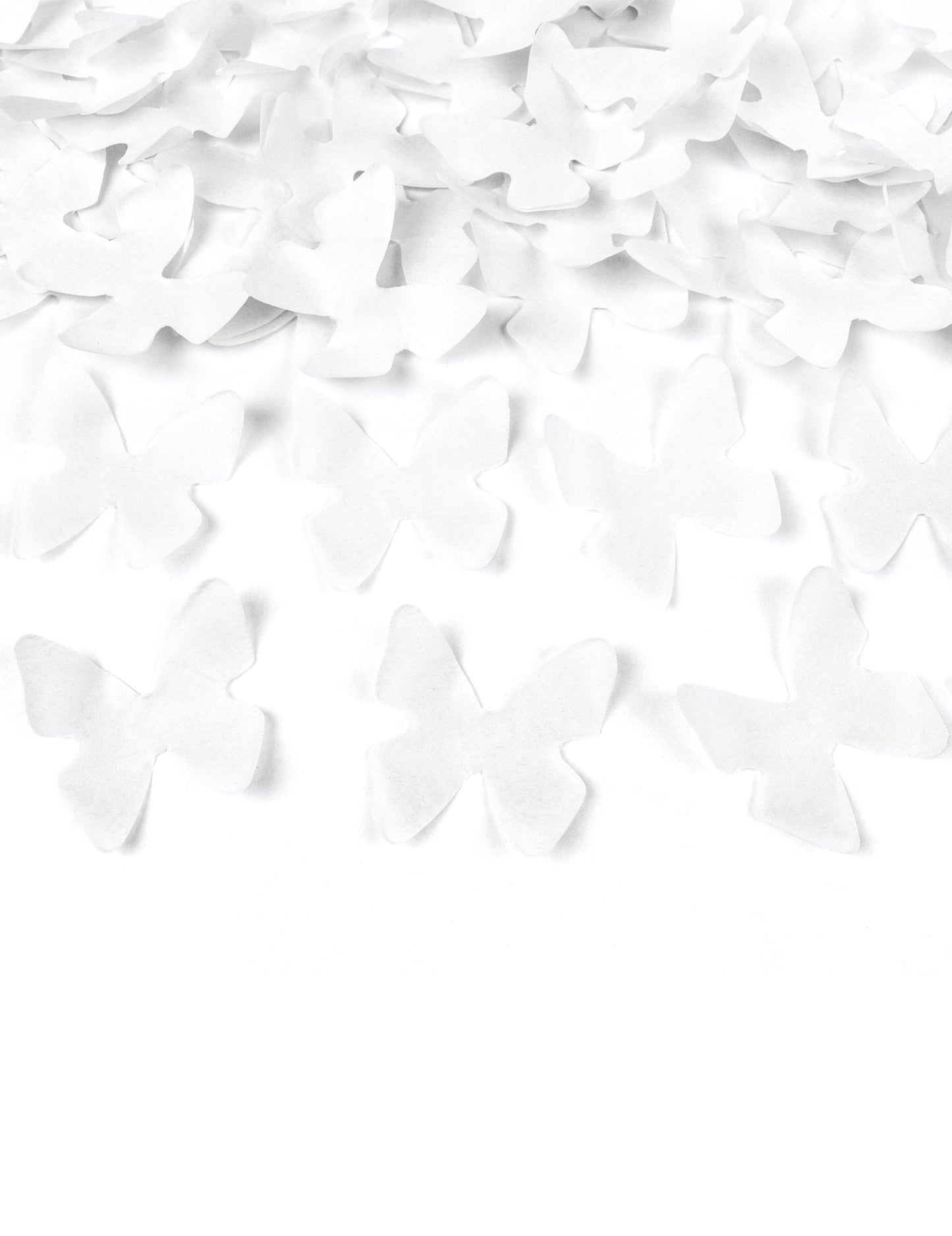 Détail des confettis en forme de papillons du canon à confettis papillons blancs
