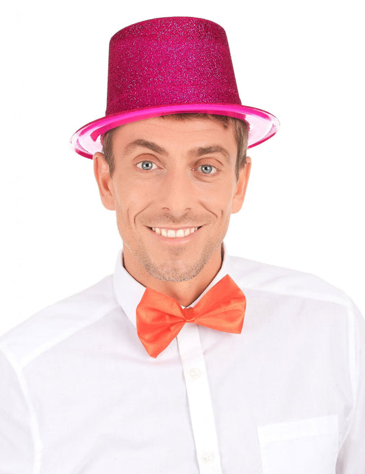 Vue de face du chapeau haut de forme pailleté pour adulte fuschia