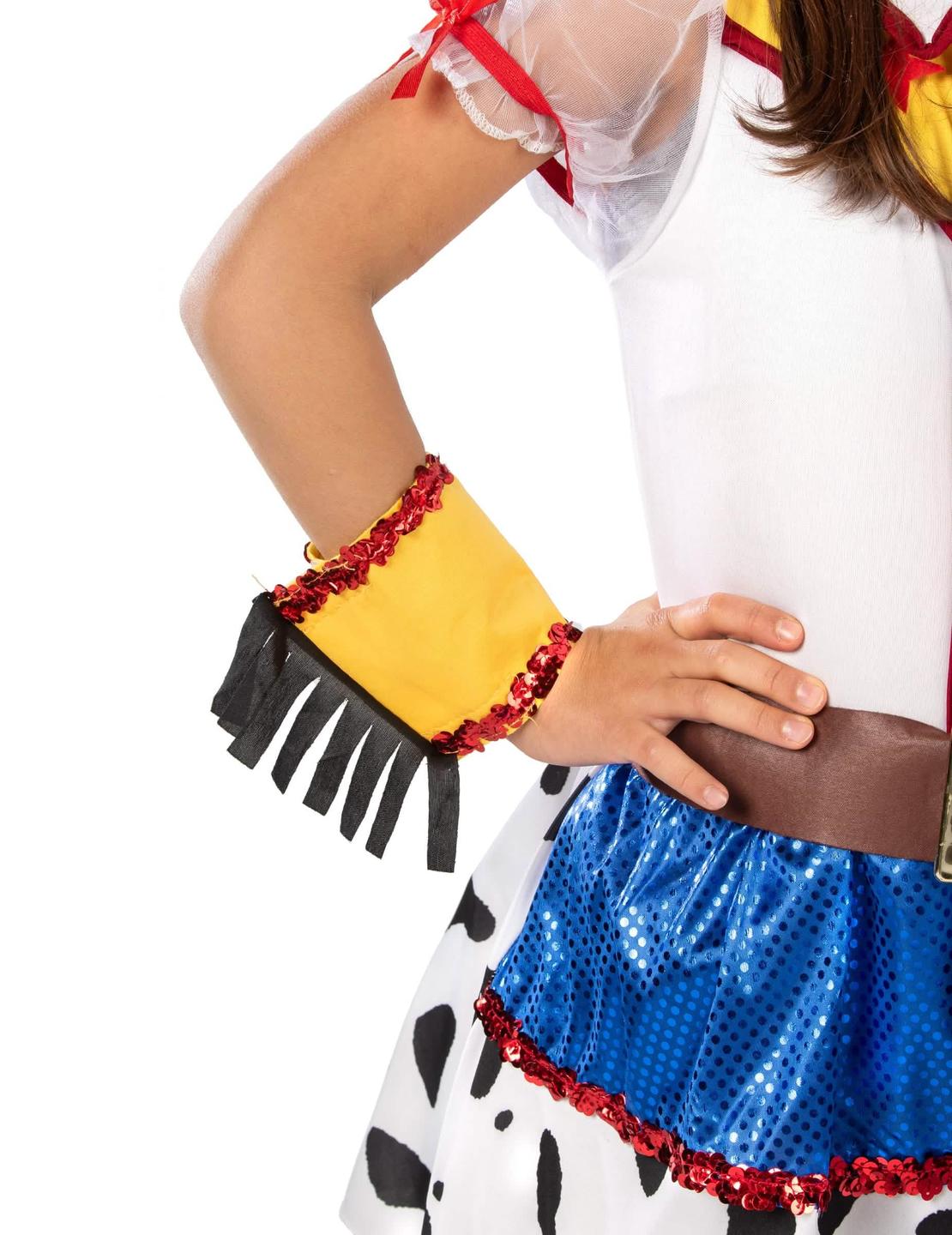 A rajzfilmes cowgirl jelmez rojtos és flitteres mandzsettájának részlete