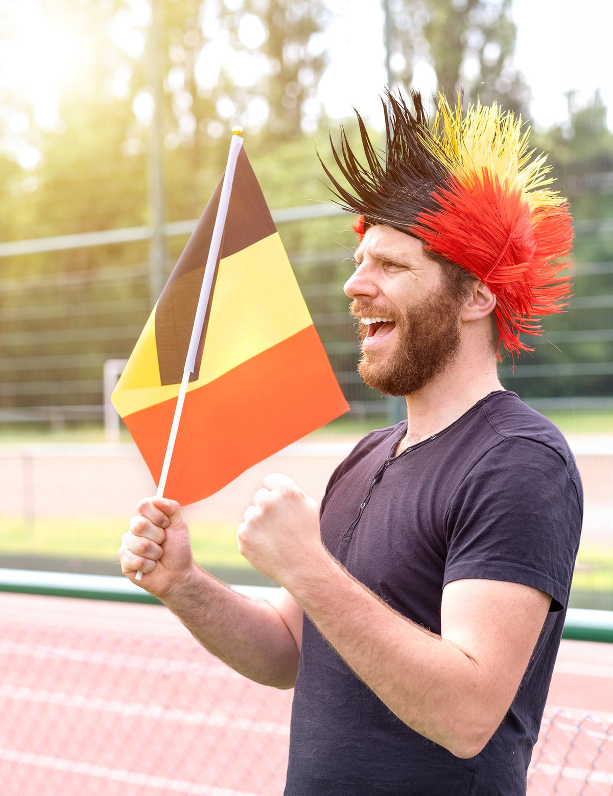 Vue de profil d'un supporter avec le Drapeau Belgique