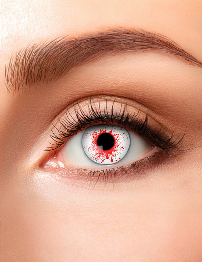 Lentilles fantaisie oeil ensanglanté pour adulte blanches avec taches de sang rouge