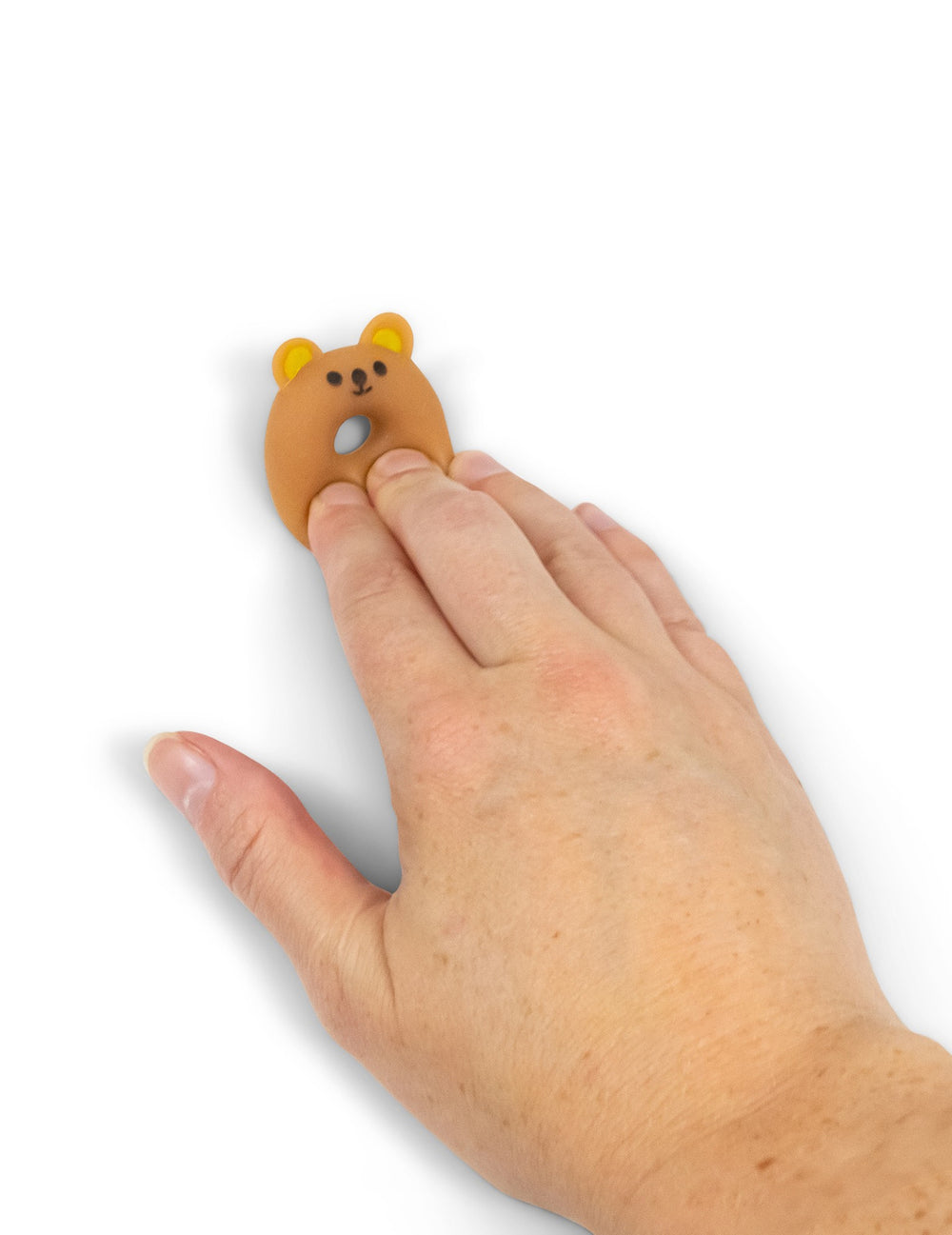 Détail de la prise en main du jouet mini animal squishy multicolore en forme de donut