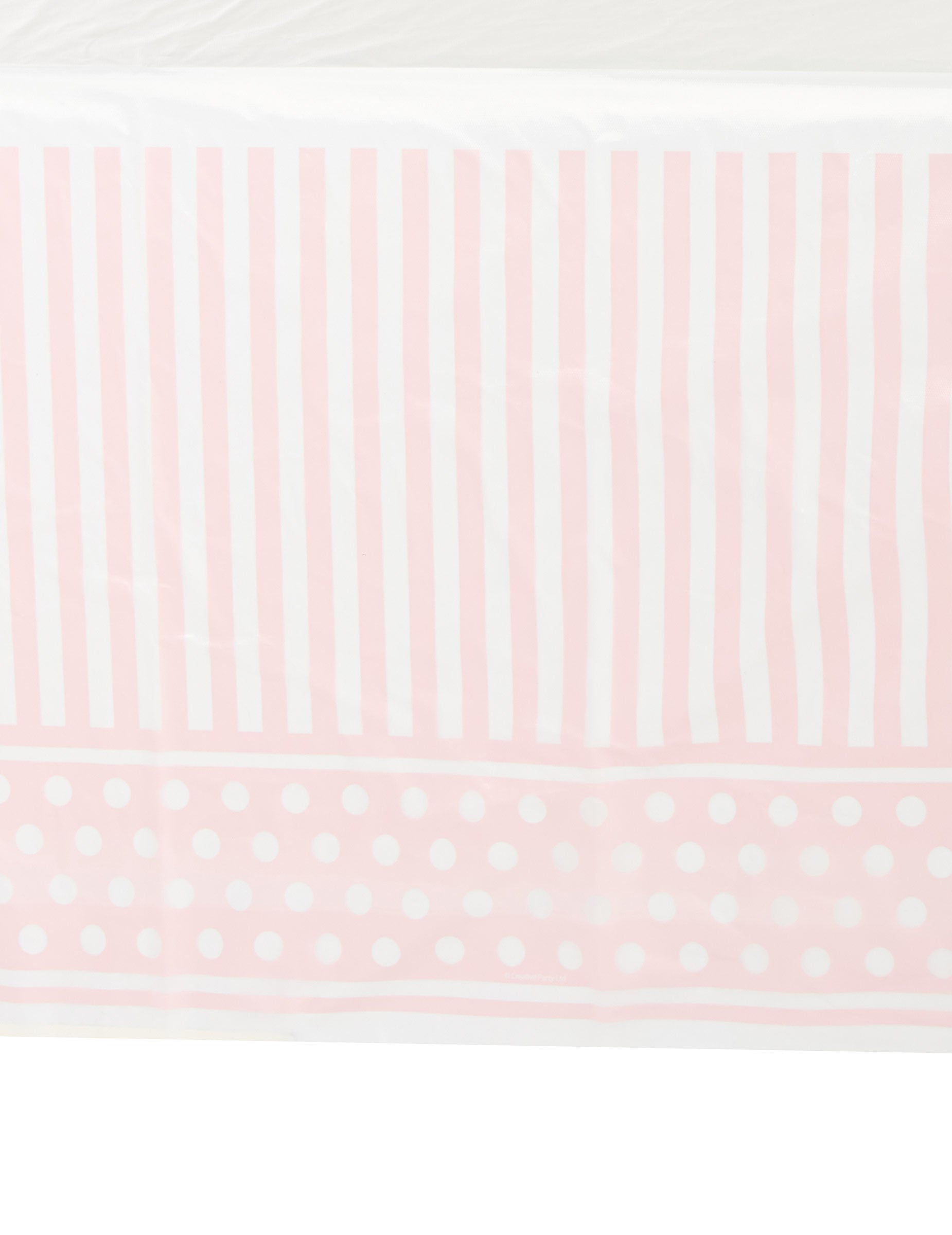 Détail du motif de la nappe en plastique rayé et à pois rose et blanc