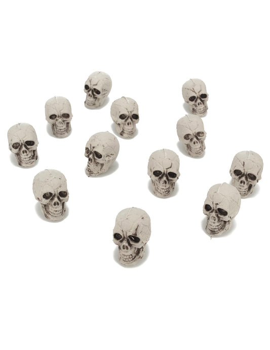 12 petites têtes de mort pour décoration en plastique blanc cassé