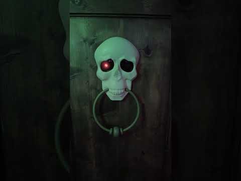 Décoration de porte sonore et animée squelette 30 cm