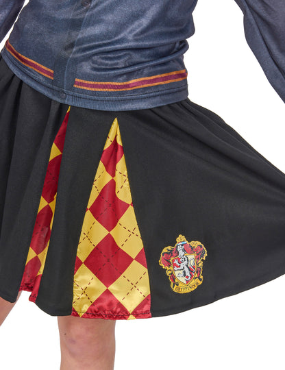 Détail du blason et des plis à losanges de la jupe du top avec jupe Gryffondor Harry Potter™ pour fille